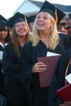 Nursing graduate Beth McDowell flashes a smile as she leaves the graduation ceremony to see her family and friends. - Photo by Stephanie Schroeder
