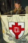 Senior class president and Accounting graduate Karie Thomas carried the banner toward the Great Lawn for the spring 2007 graduation ceremony. - Photo by Matthew Diggs