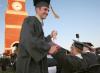 Tyler Porter and Clay Manley high-five each other after receiving their diplomas. - Photo by Kyle Kurlick
