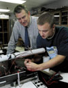 05/10/02 - Dr. Kyle Hathcox, professor of physics, works with Junior Joel Fern on a physics project.