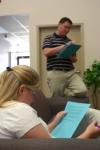 Neal Rager, coordinator of student leadership, goes over a survival activity sheet with the Rising Seniors. - Photo by Stephanie Schroeder