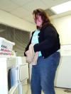 Amanda Middleton does her laundry in the McAfee Commons laundry room. - Photo by Beth Spain