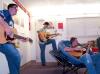 Sophomore Digital Media Studies Major Jason Allison, Sophomore Biology Major John William Micheal, and Sophomore Michael Glenn Lee all play guitar in their Lee dorm in the McAfee Residence Complex. - Photo by Beth Spain
