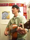 Sophomore Biology Major John William Michael plays a little bit of guitar in his Union dorm room. - Photo by Beth Spain