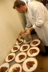 Chef Greg prepares the desserts for the Etiquette Luncheon. - Photo by Morris Abernathy