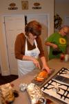 Provost Carla Sanderson prepares food for students in her home for Be Our Guest. - Photo by Morris Abernathy