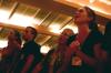 Jessica Yates and her family sings along during the family chapel on the first day of orientation. - Photo by Stephanie Schroeder