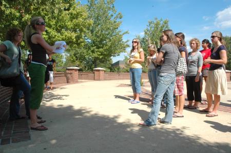 Sophomore Public Relations Major Elizabeth Wood explains the rules of a scavenger hunt to her Focus group.