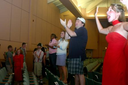Kasey Kobb, Josh Clarke, Brittany Howerton, Wende Jackson and other SAC members cheer on and welcome the freshman as they enter the chapel for SAC's Game Show during Focus orientation.