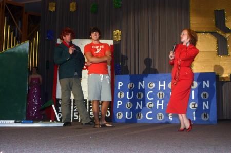 Kinsey Bolinger and Kieler Henry host the SAC game show during orientation.