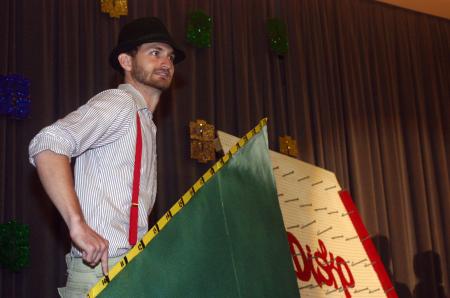Ronald Long played the mountain man and had to climb the mountain as participants guessed the price of various items during the SAC game show at orientation.