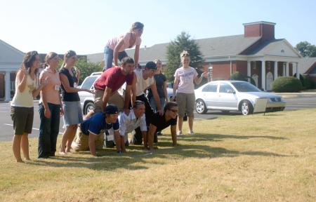 Kirby Maxwell's Focus group creates a pyramid in front of Englewood Baptist Church as part of their scavenger hunt through Jackson.