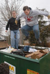 01/20/03 - Ben Mandrell (left) and Mark VanderHaar give it their all while on clean up duty at The Care Center during Martin Luther King Jr. service day.
