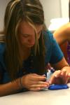 Mikaela Owens-Hughes works on a Play-Dough sculpture in her Focus group that will describe some aspect of her life. - Photo by Stephanie Schroeder