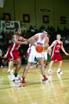 02/46/03 - Sophomore Bruno Martinessi (32) is fouled by a Hannibal-LaGrange player.