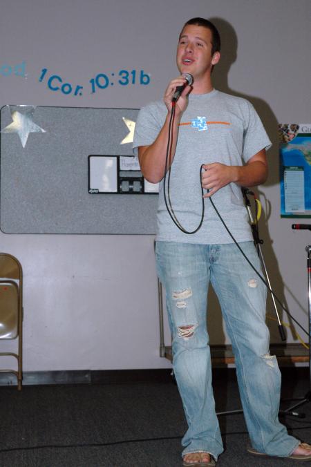 Dave Darty shares his singing ability with new students in the student lounge on Open Mic night. 