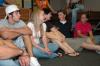 Sophomore Jewel Marshall (center in white) enjoyed some laughs with her friends while watching Open Mic night.  - Photo by Neisha Fuson