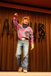 Freshman Chawalit Wongkhaio performs part of the electric slide and then follows it up with some stand-up comedy during the talent show portion of Mr. Campus, an event sponsored by PRSSA. - Photo by Stephanie Schroeder