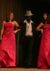 Carolyn Negley and Ashton Bruce escort Freshman Eric Uwiringiyemana out for his evening wear presentation during Mr. Campus. - Photo by Stephanie Schroeder