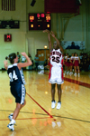 02/44/03 - Junior Christal Merriwhether (25) puts up a three-pointer over the head of a Lady Eagle.
