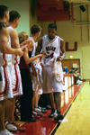 02/46/03 - Senior Derrick Underwood (54) gets congrats from his teammates as he takes a rest.