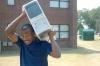Jeremiah Hawkins finds creative ways to move a computer tower during move-in day.  - Photo by Matthew Diggs