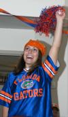 09/15/07 - Sophomore Leah Heinsch cheers on her football team as she and others watch the game projected on a wall in McAfee Commons.