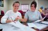 9/18/07 - Freshmen Ashley Freeland and Cassie Badillo work together according to the newly implemented POGIL method to solve problems in Dr. Merkin’s chemistry class in White Hall.
- Matthew Diggs