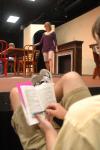 Junior Matt Stimmel sits off stage and follows along in his script as fellow Union students rehearse for <em>The Dining Room</em>. - Photo by Neisha Fuson