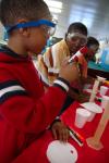 9/27/07 - Children at a Boys and Girls Club enjoy playing with and learning about science when some Union students went to share their knowledge of physics, chemistry and engineering. - Neisha Fuson
