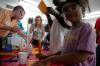 9/27/07 - A girl from the Boys and Girls Club works on an experiment at one of the chemistry tables. - Neisha Fuson