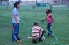 Jasmine Huang helps children do an engineering experiment at a Boys and Girls Club meeting.  - Photo by Neisha Fuson