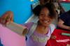 9/27/07 - A girl from a Boys and Girls club shows her beginnings of a paper towel rocket.  - Neisha Fuson