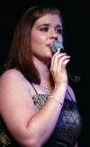 Kelly Palmer, emcee to All-Sing during Family Weekend, performs a solo number. - Photo by Stephanie Schroeder