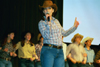 ZTA Allison Seaman entertains at All-Sing during Homecoming 2003. - Photo by Lindsay Stavish