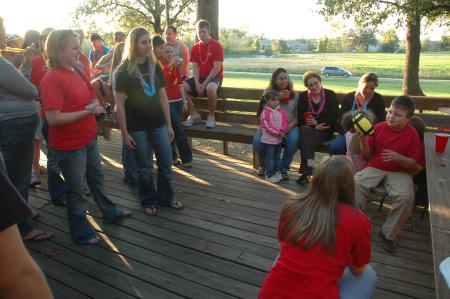 Armando plays with a new football at the Chi Omega Make-A-Wish foundation party for Armando. 