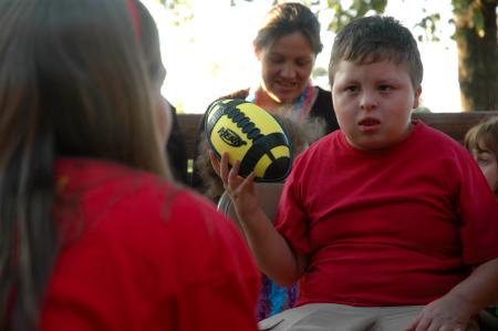Armando, a child with the Make-A-Wish Foundation, plays with one of the presents he recieved at a party sponsored by Chi Omega. 