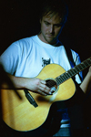 Bebo takes a moment during the coffeehouse concert. - Photo by Lindsay Stavish