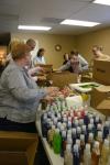 Phyllis Davenport, Nurse Paul Mayer, and students sort through boxes of bath goods to be repackaged into gift bags for mothers at Birth Choice during Day of Remembrance. - Photo by Stephanie Schroeder