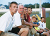 08/243/02 - Jay Roberts, junior trainer; Bill Lean, father of Chris and Jeff Lean; Darin White, soccer coach and Kyle McDiarmid, junior midfielder, watch as the Bulldogs play Covenant College.
