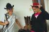 Sophomores Chanel Watson and Bethany Anderson play in the western gear to be used for decorations at the J-Crib Ministry during Day of Remembrance.  - Photo by Neisha Fuson