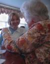 Freshman Claire Elmbald visits with a lady who lives at Cheyenne Trace on this year's Day of Remembrance.  - Photo by Neisha Fuson