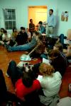 Taylor Worley lectures on Damien Hirst, star of the Young British Artists, in a weekly gathering of the Society for Critical Imagination. - Photo by Matt Elia