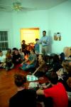 Taylor Worley lectures on Damien Hirst, star of the Young British Artists, in a weekly gathering of the Society for Critical Imagination. - Photo by Matt Elia