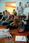 Taylor Worley lectures on Damien Hirst, star of the Young British Artists, in a weekly gathering of the Society for Critical Imagination. - Photo by Matt Elia