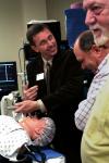 Mark Kossick demonstrates the new simulation technology in White Hall during the School of Nursing's homecoming reception. - Photo by Kristi McMurry
