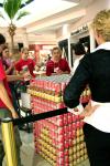 11/5/07 - Lori Nolen (foreground), assistant professor of art, and Kay Montgomery (center), social work's DCS project coordinator, survey the progress of Miller Tower constructed of cans. These cans will later be given to R.I.F.A. - Kristi McMurry