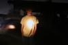 11/17/07 - A Watters resident stands outside during a campus-wide blackout talking to people and waiting for the power to come back on.  