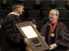 12/15/07 - President Dockery presents the Doctor of Humanities award to Stephen C. Reynolds at December Graduation.