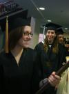 12/15/07 - Senior Class President Jill Casey leads the way as Art graduate Heather Couch and the Fall 2007 graduates follow her in the processional. - Stephanie Schroeder